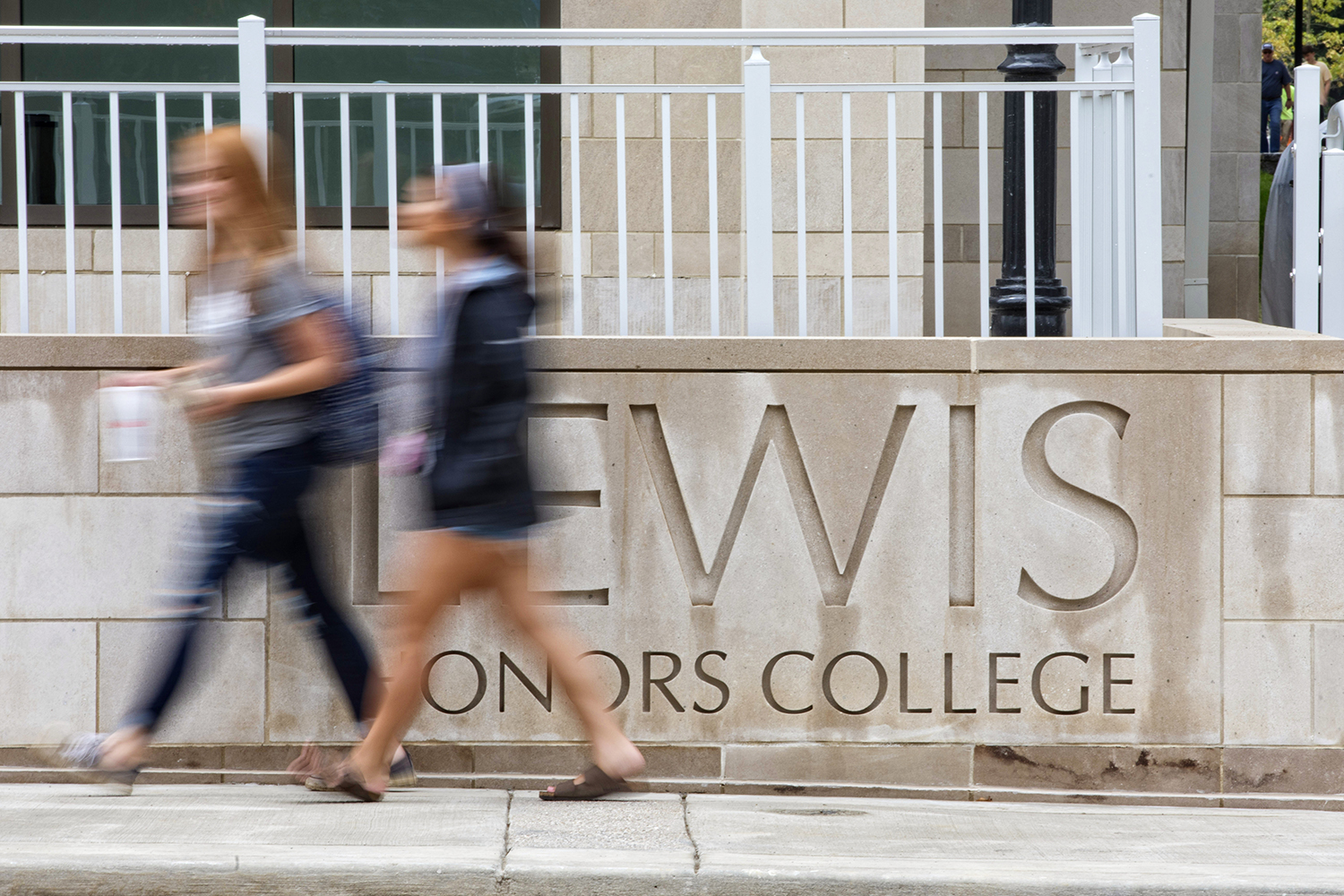 women-walking-by-Lewis-Honors-College