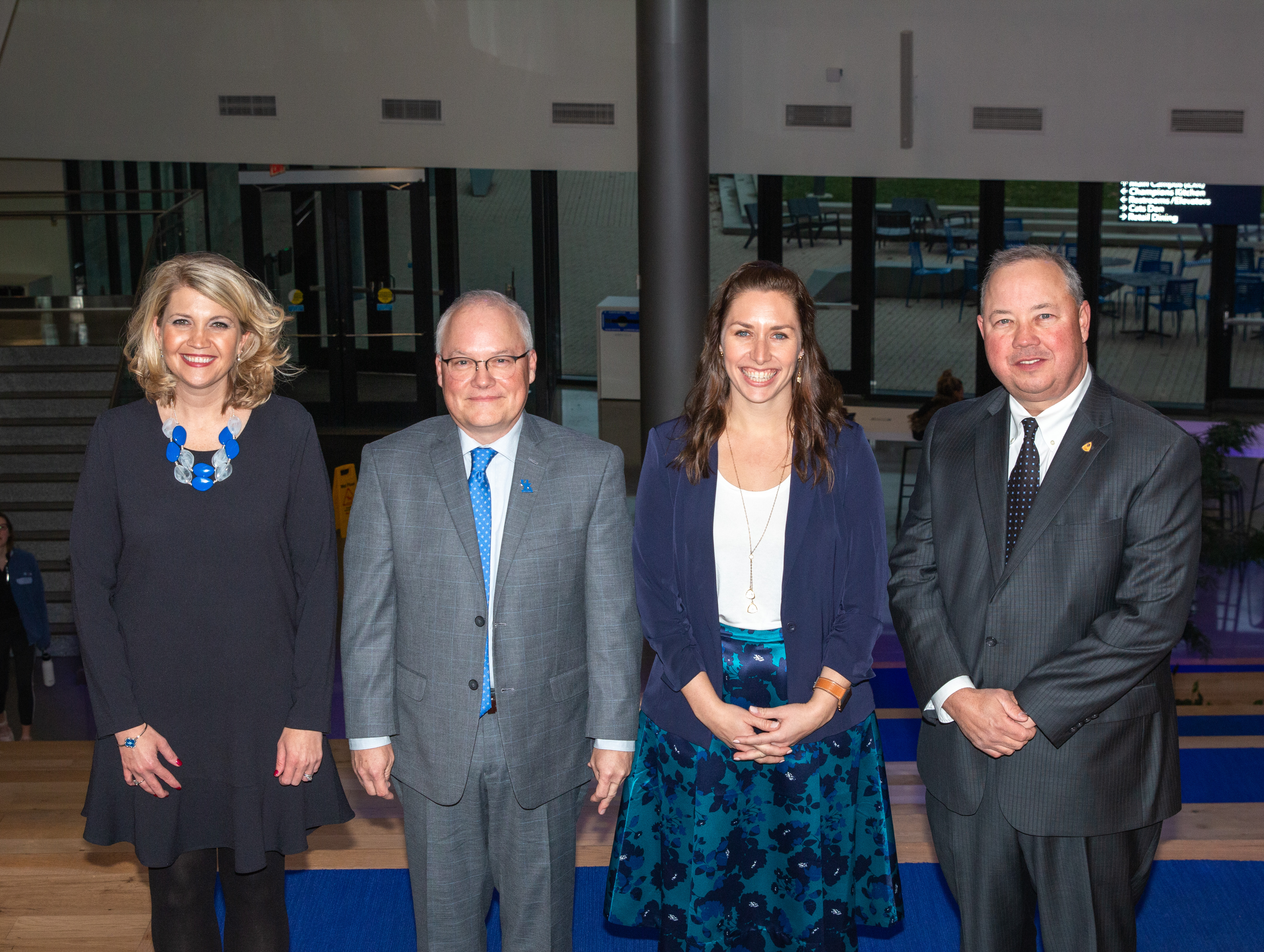 Past Mobley recipient award winners standing and smiling to have their picture taken