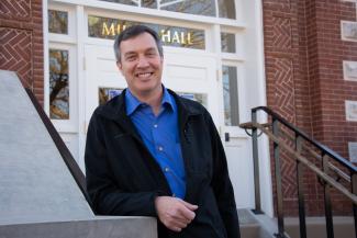 Dr Andrews standing in front of Miller Hall